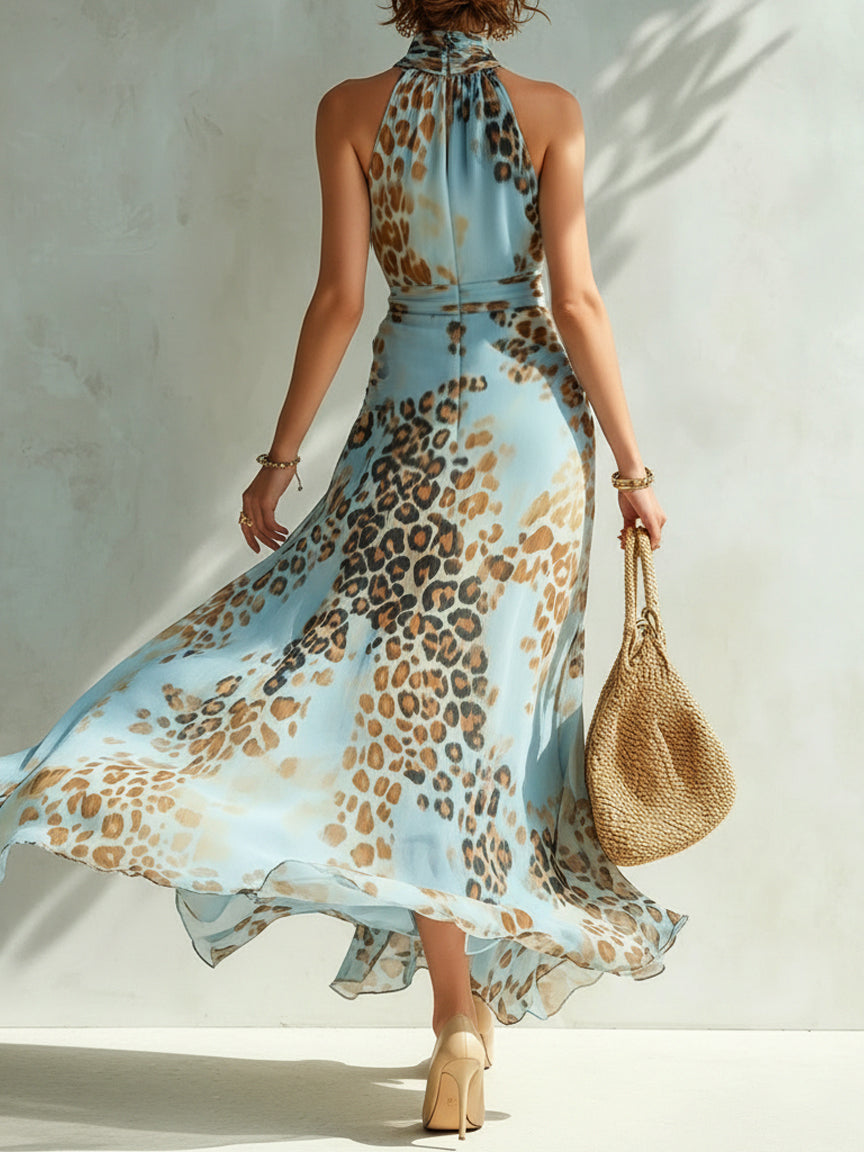Back view of the Elysia glamorous animal print maxi dress, revealing the tie-fastened open back design.