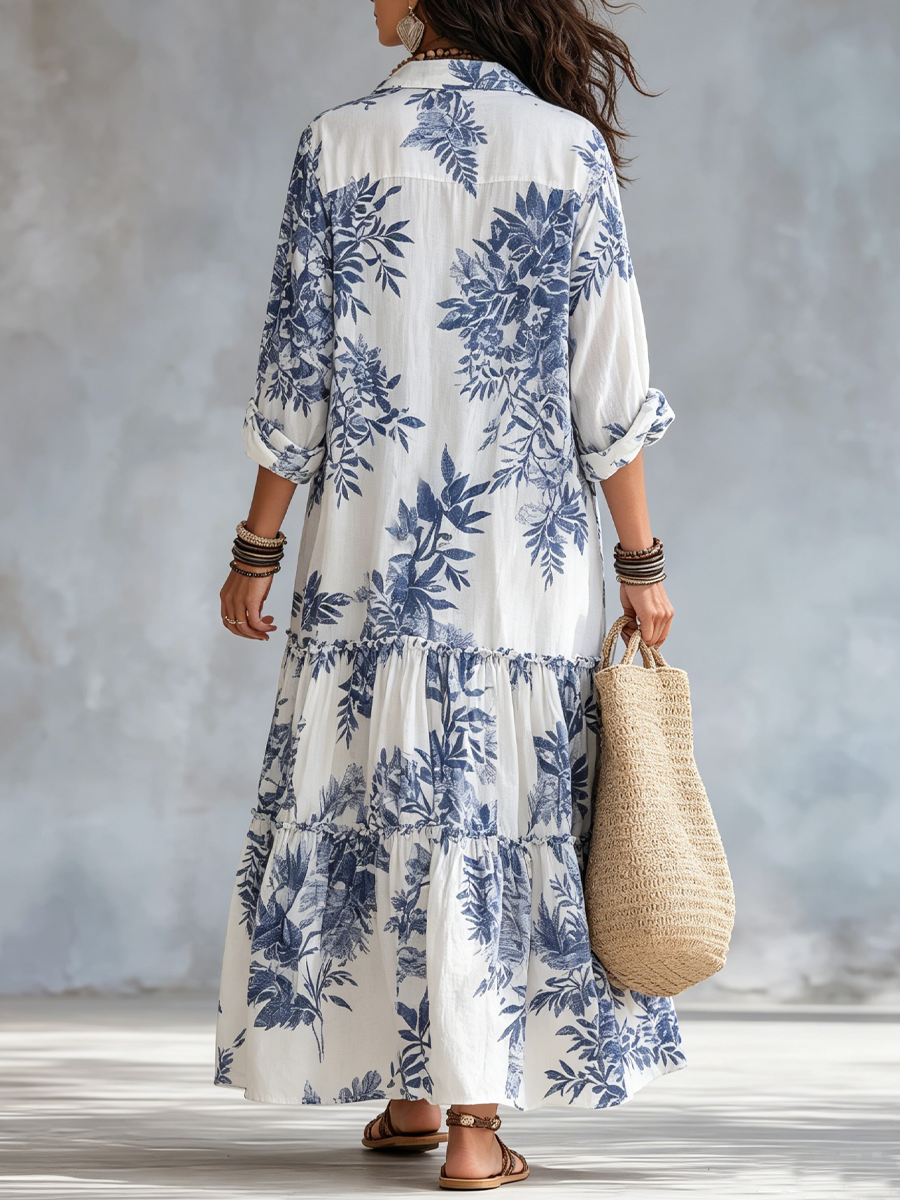 Back view of the blue floral short sleeve maxi dress, highlighting the all-over print and maxi length.