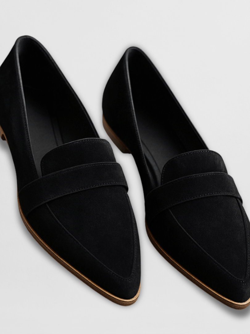 Overhead view of a leopard print suede loafer, showing the interior lining and cushioned insole for comfort.