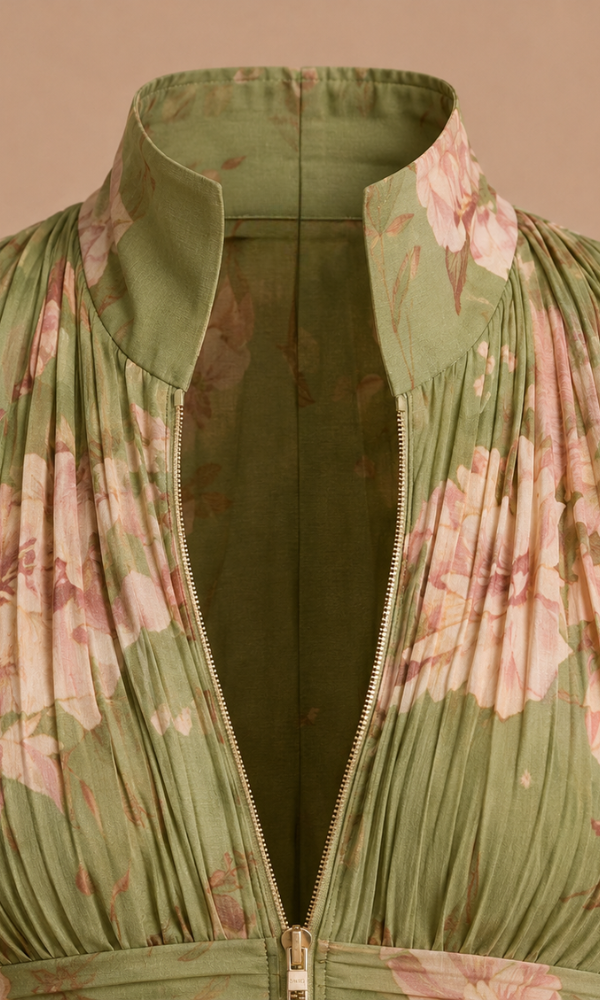 Side profile of a model wearing the green wide-leg women's jumpsuit, showcasing its flowing silhouette.