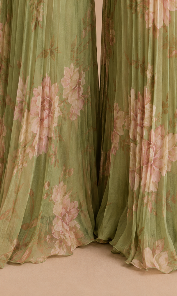 Back view of the solid green women's jumpsuit, highlighting the full length and comfortable fit.