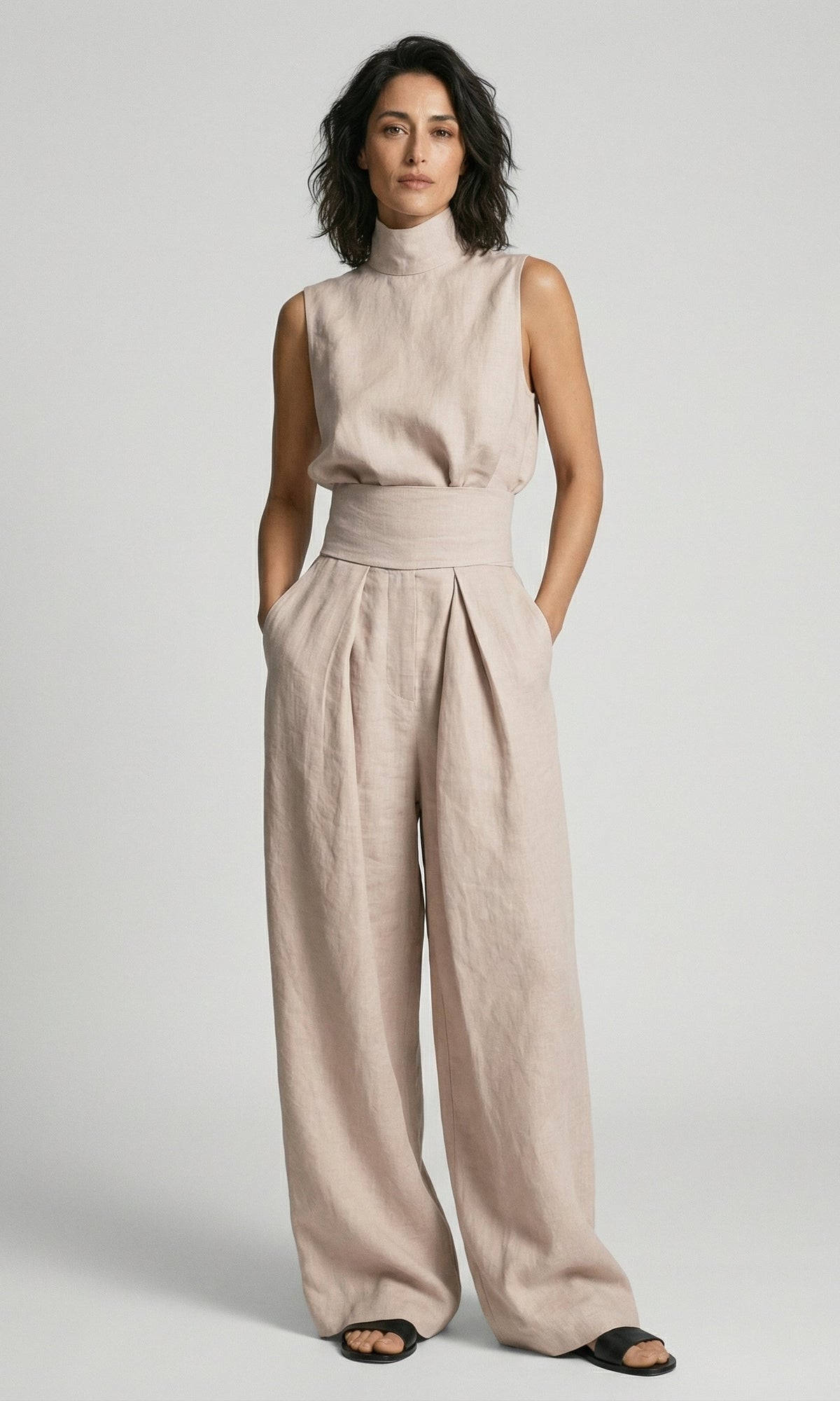 Close-up of the natural cotton fabric on the wide-leg trousers, showing its soft, breathable weave.