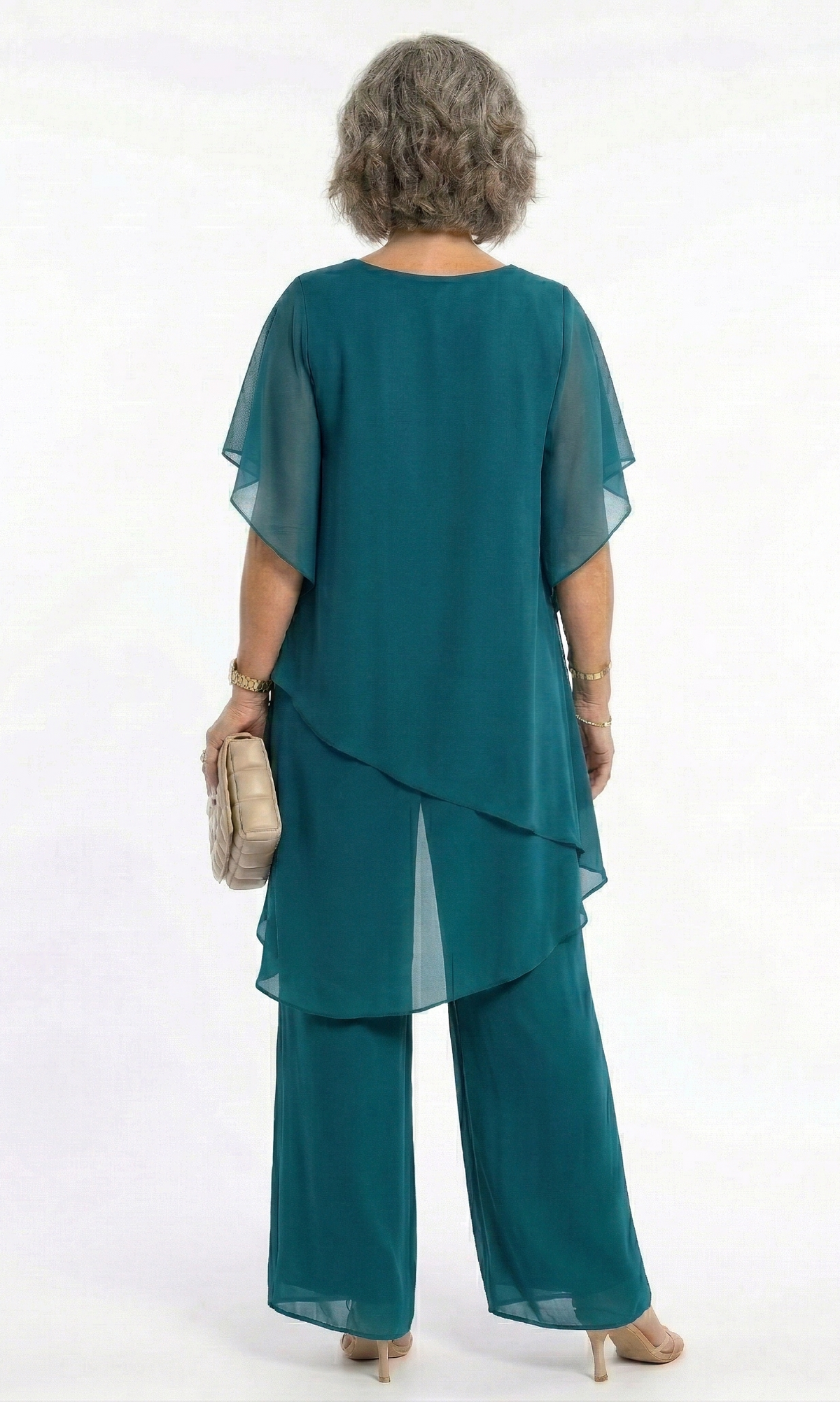 Detail shot of the neckline and shoulder area of the navy tiered blouse, emphasizing its quality and finish.