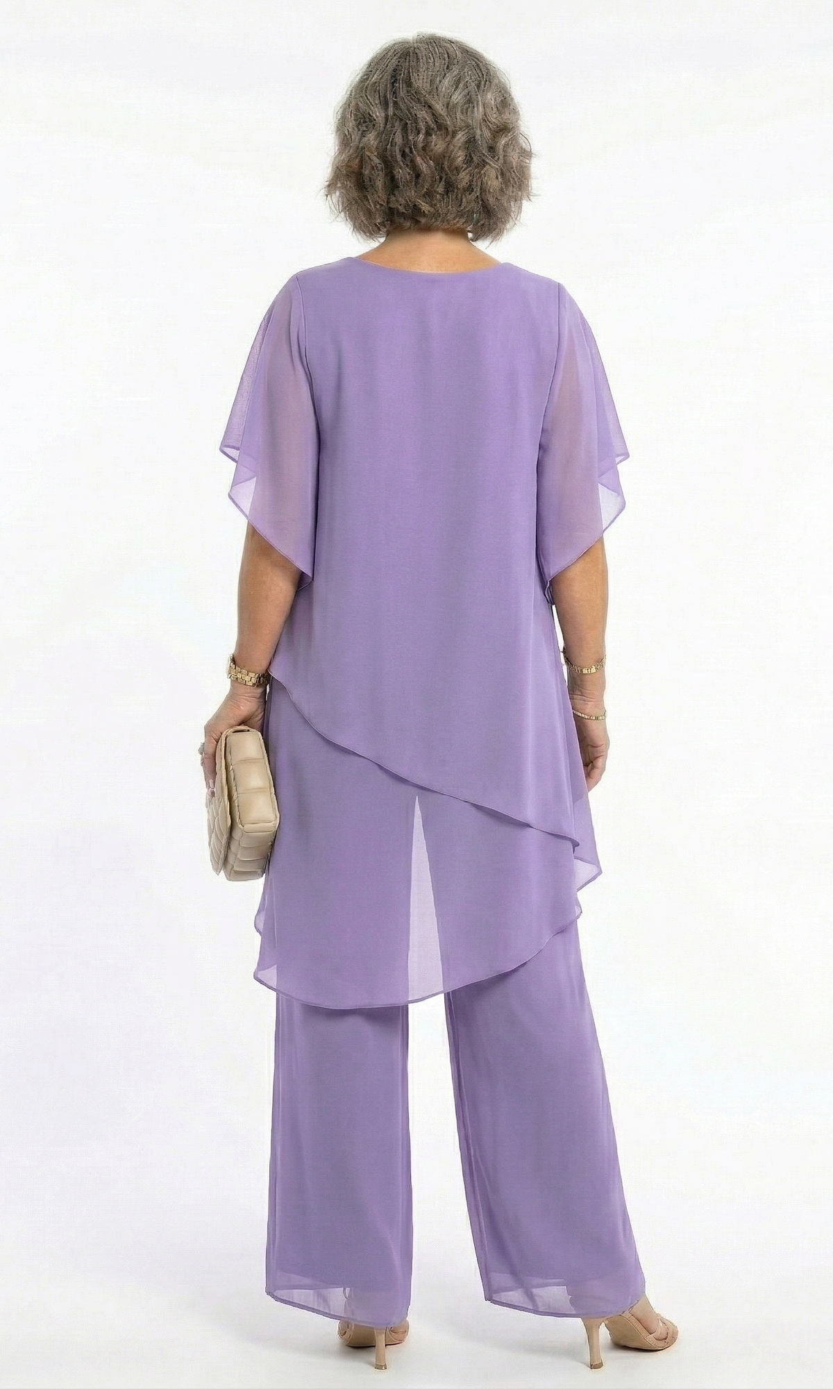 A model smiling confidently in a burgundy Tamsin tiered blouse, exuding professionalism and comfort.
