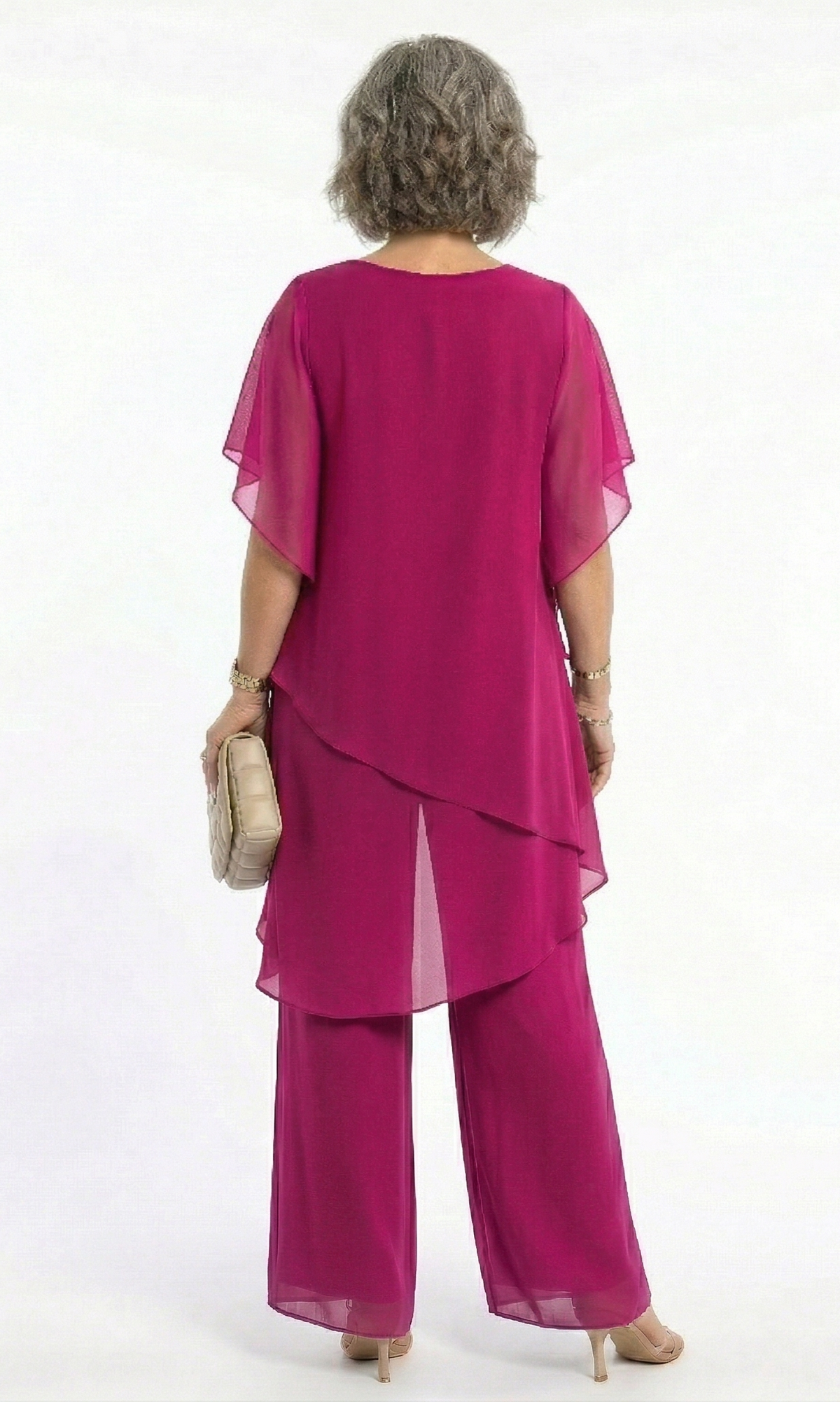 A stack of folded Tamsin blouses in various available colors, highlighting the range of choices.