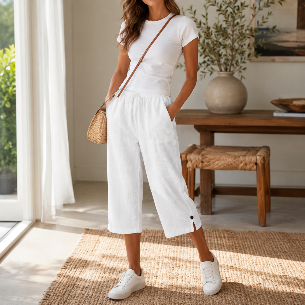 Side profile of a woman in breathable cotton-linen trousers, highlighting the fabric's drape.