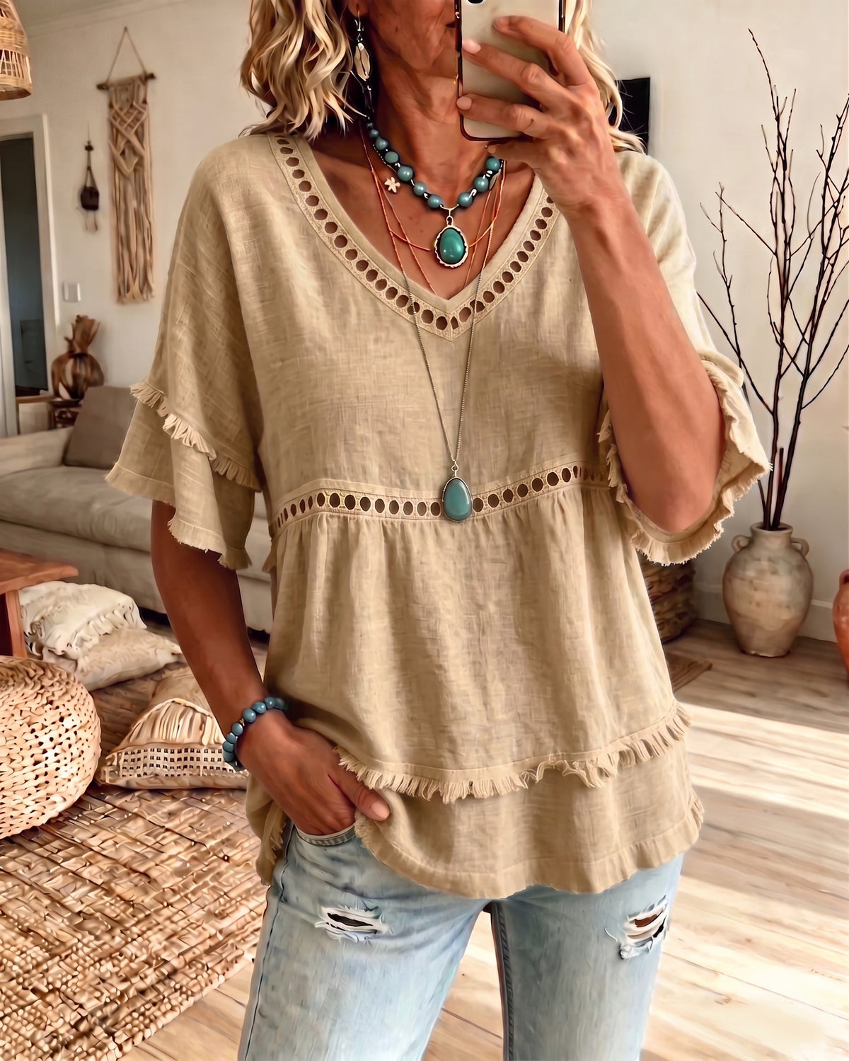 Side profile of a model wearing the relaxed fit Elowyn blouse, demonstrating its flowing silhouette and ease.
