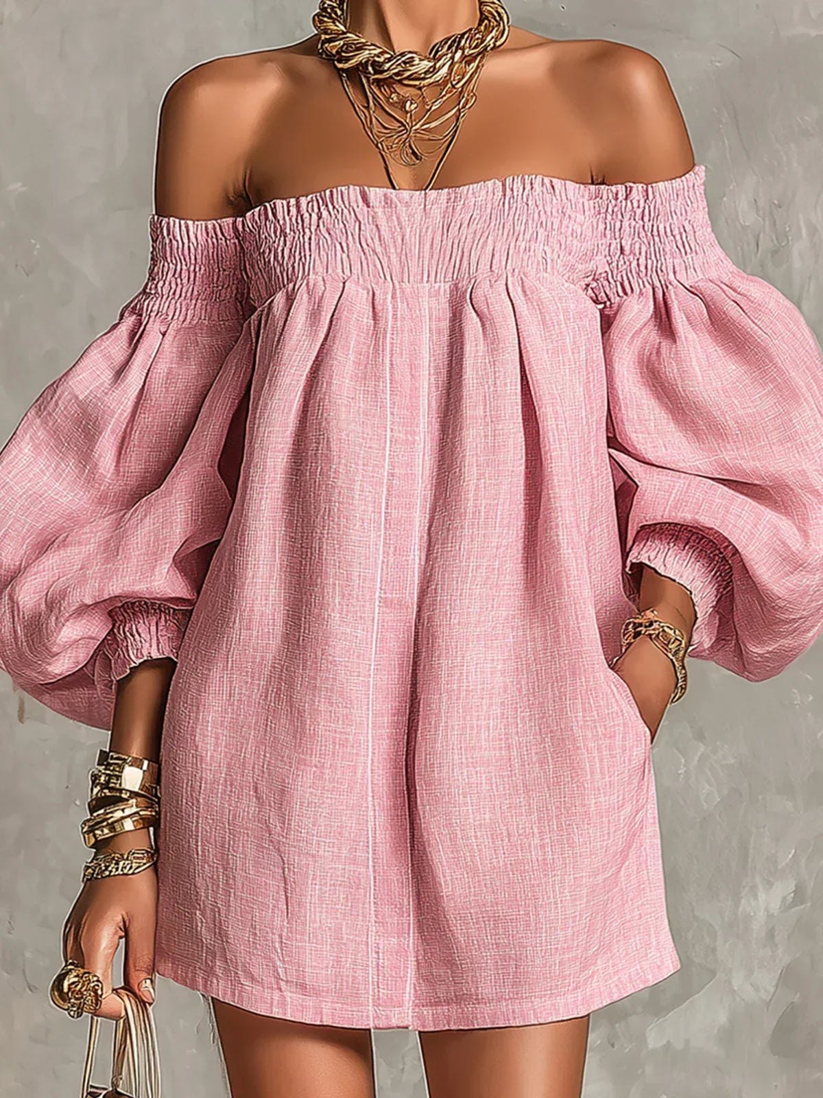 Side view of the pink off-shoulder mini dress, highlighting the flowing A-line shape and movement.