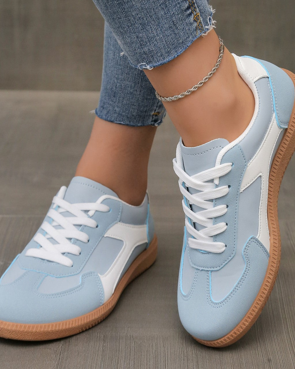 Close-up of the sky blue Adaline orthopaedic shoe, showing the breathable upper material and stitching details.