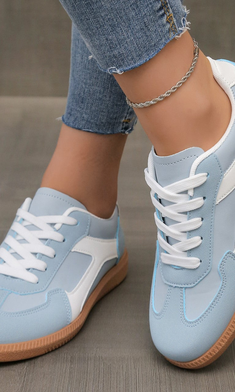 Close-up of the sky blue Adaline orthopaedic shoe, showing the breathable upper material and stitching details.