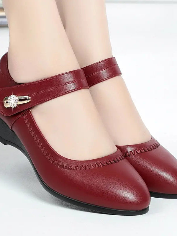 Close-up of the adjustable strap and buckle on the Alana shoes, showing the customizable fit feature.