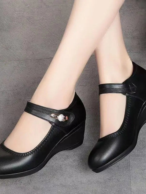 A pair of Alana mid-heel comfort shoes in beige, styled casually to show their versatility for various outfits.