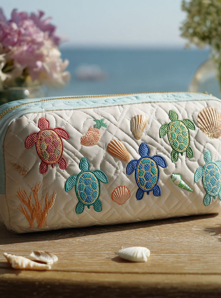 Elegant Anouk quilted cosmetic organizer in ispirazione marina print, showcasing its textured fabric and secure zipper closure.
