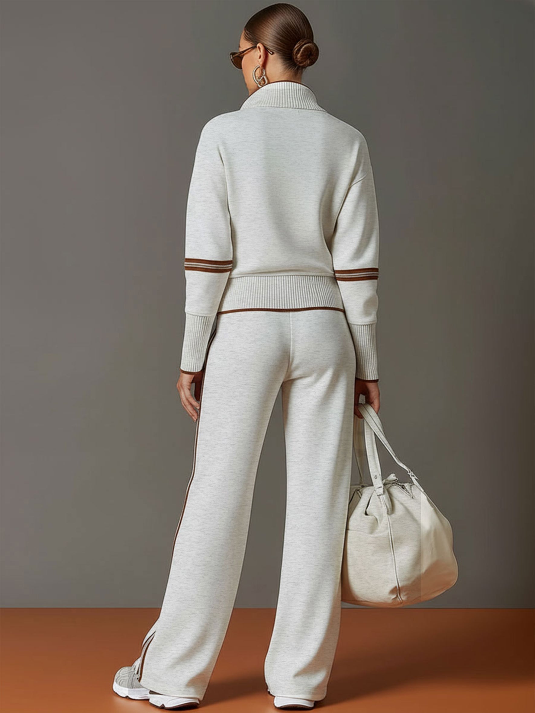 Woman styled in Anouk relaxed fit pants with complementary top, perfect for a chic, coordinated look.
