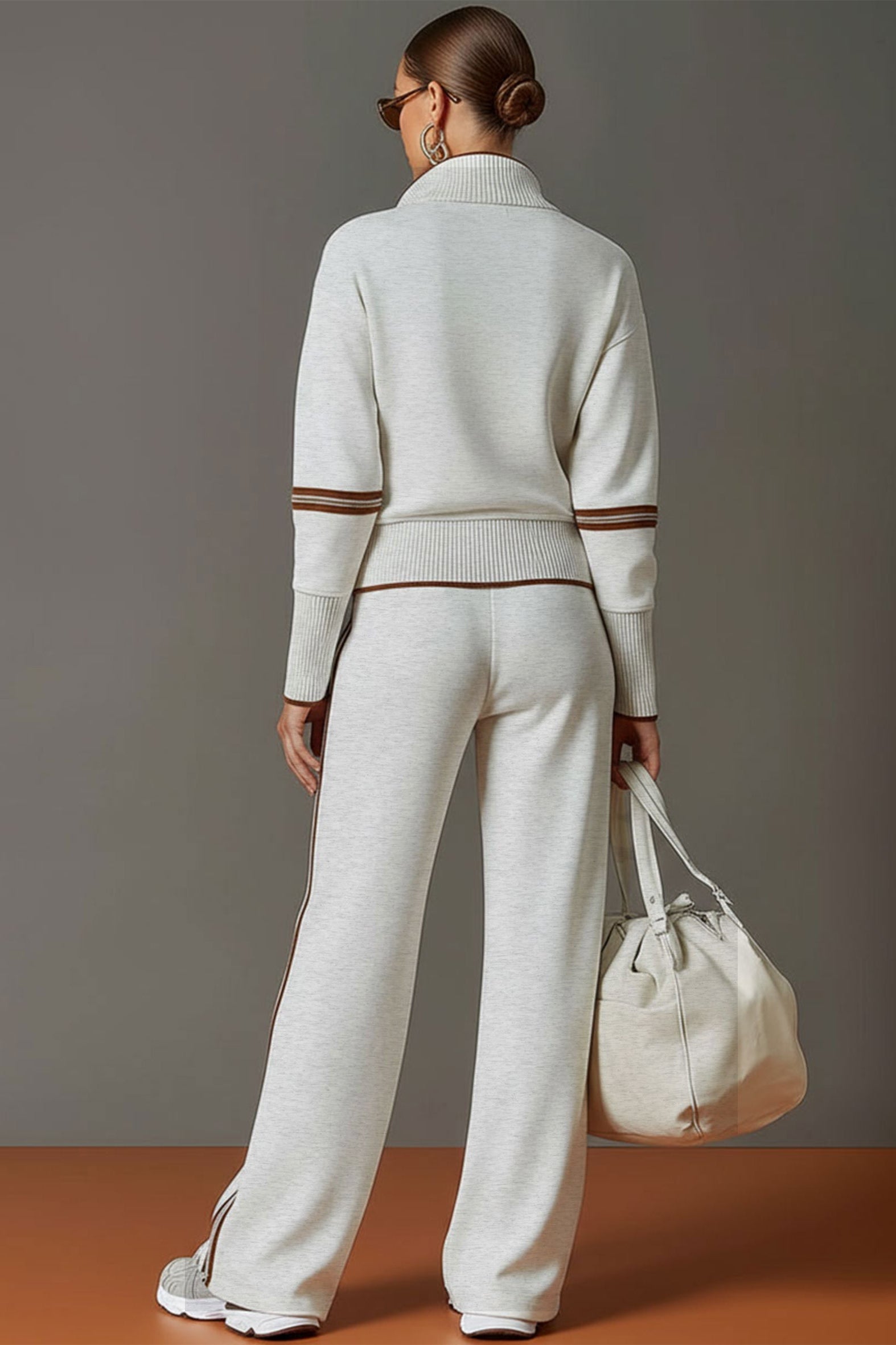 Woman styled in Anouk relaxed fit pants with complementary top, perfect for a chic, coordinated look.