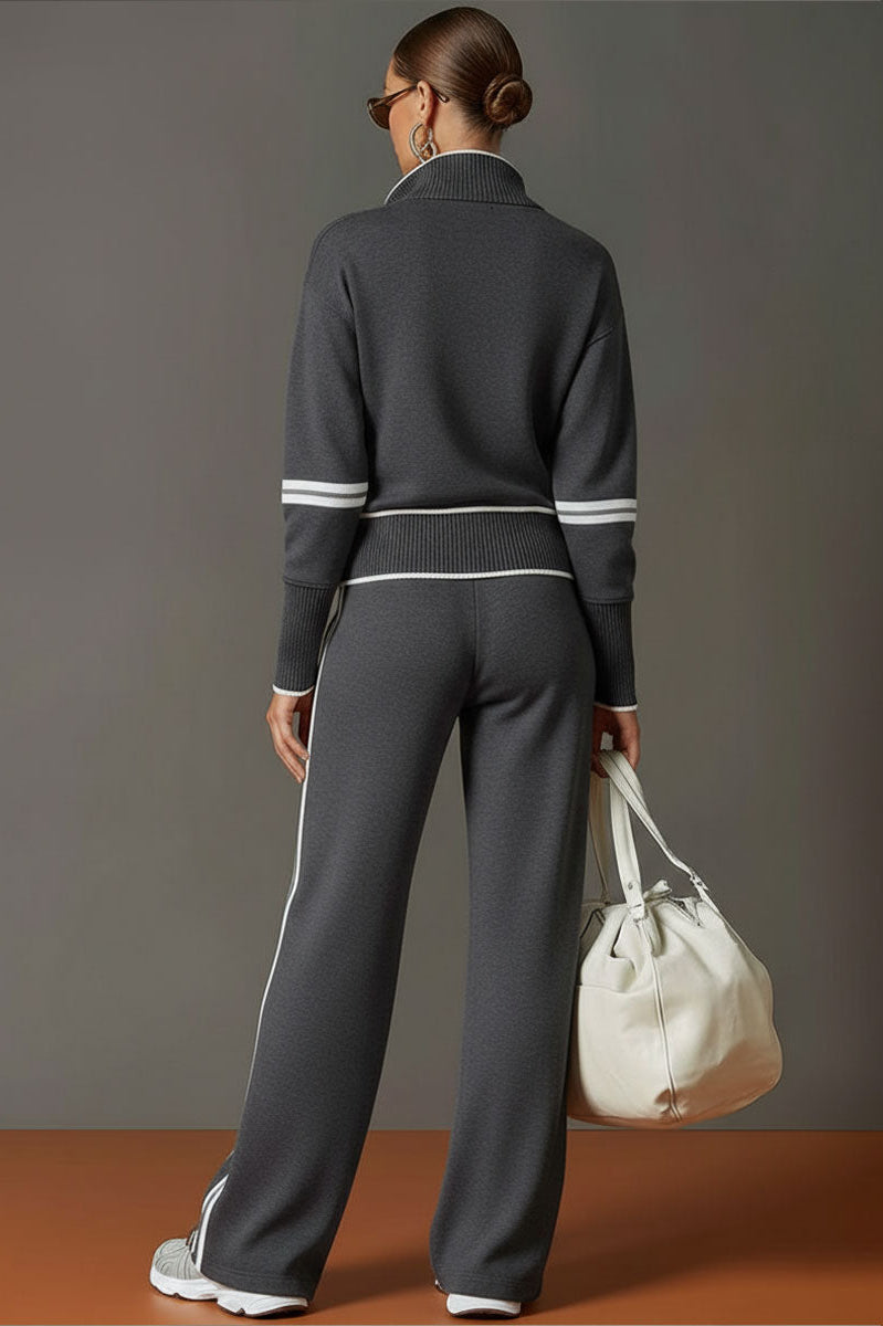 Lifestyle image of Anouk relaxed fit pants in a travel setting, suggesting their suitability for long journeys.