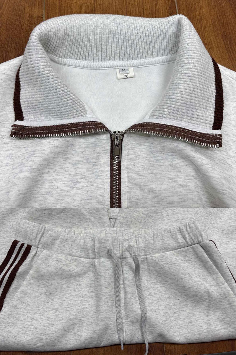 Woman in Anouk relaxed fit pants interacting in a casual environment, emphasizing practical elegance.
