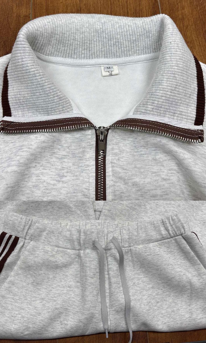 Woman in Anouk relaxed fit pants interacting in a casual environment, emphasizing practical elegance.