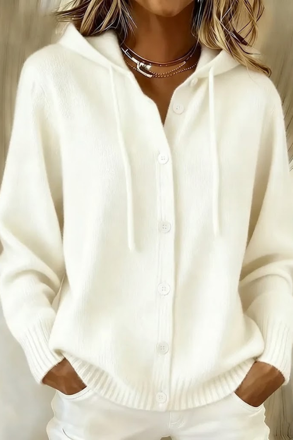 Side profile of a woman wearing a white Anouk T-shirt, highlighting the drape and casual style.