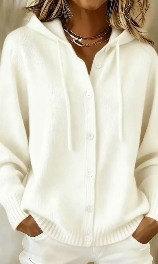 Side profile of a woman wearing a white Anouk T-shirt, highlighting the drape and casual style.