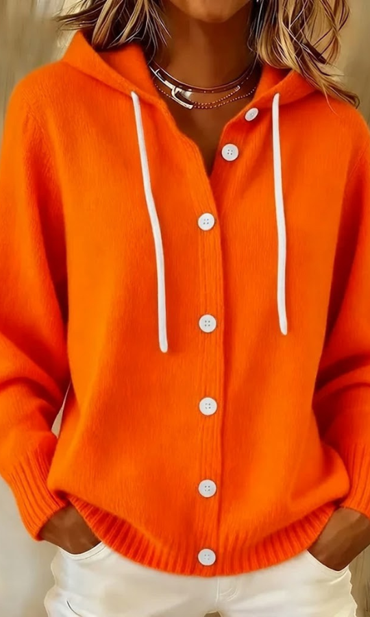 Woman wearing an orange Anouk T-shirt outdoors, demonstrating its versatility and relaxed appeal.