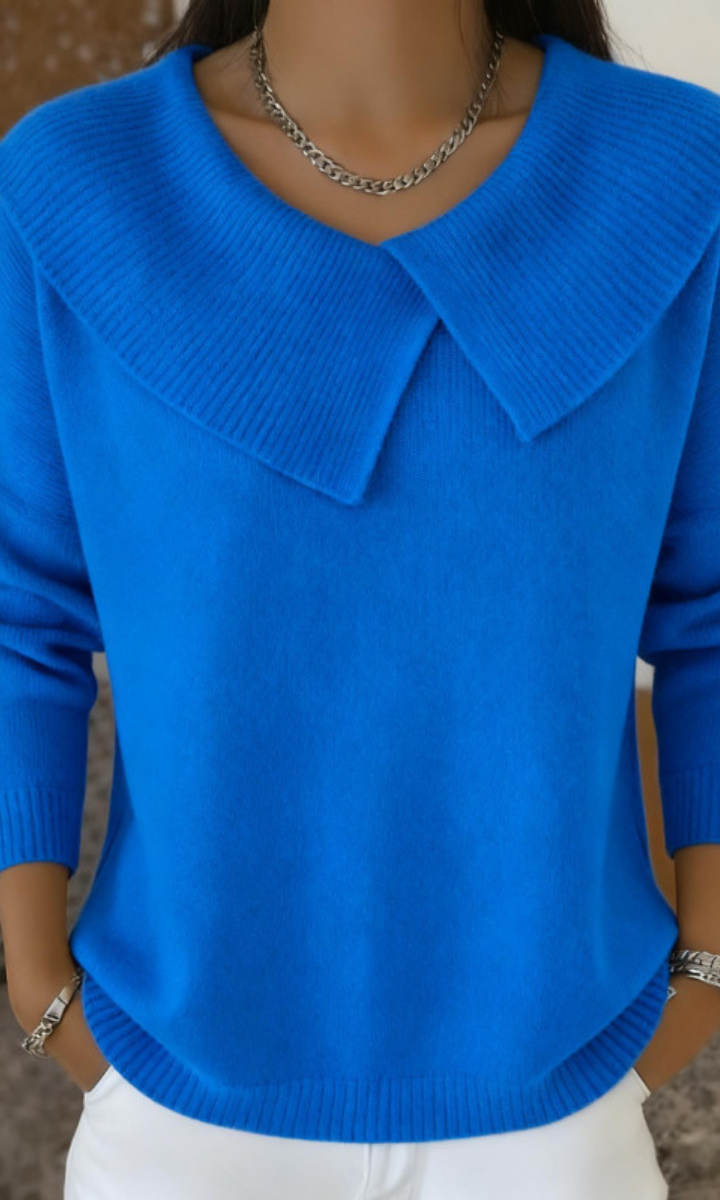 Rear view of the deep blue wool blend pants, showing the flattering fit and fabric flow.