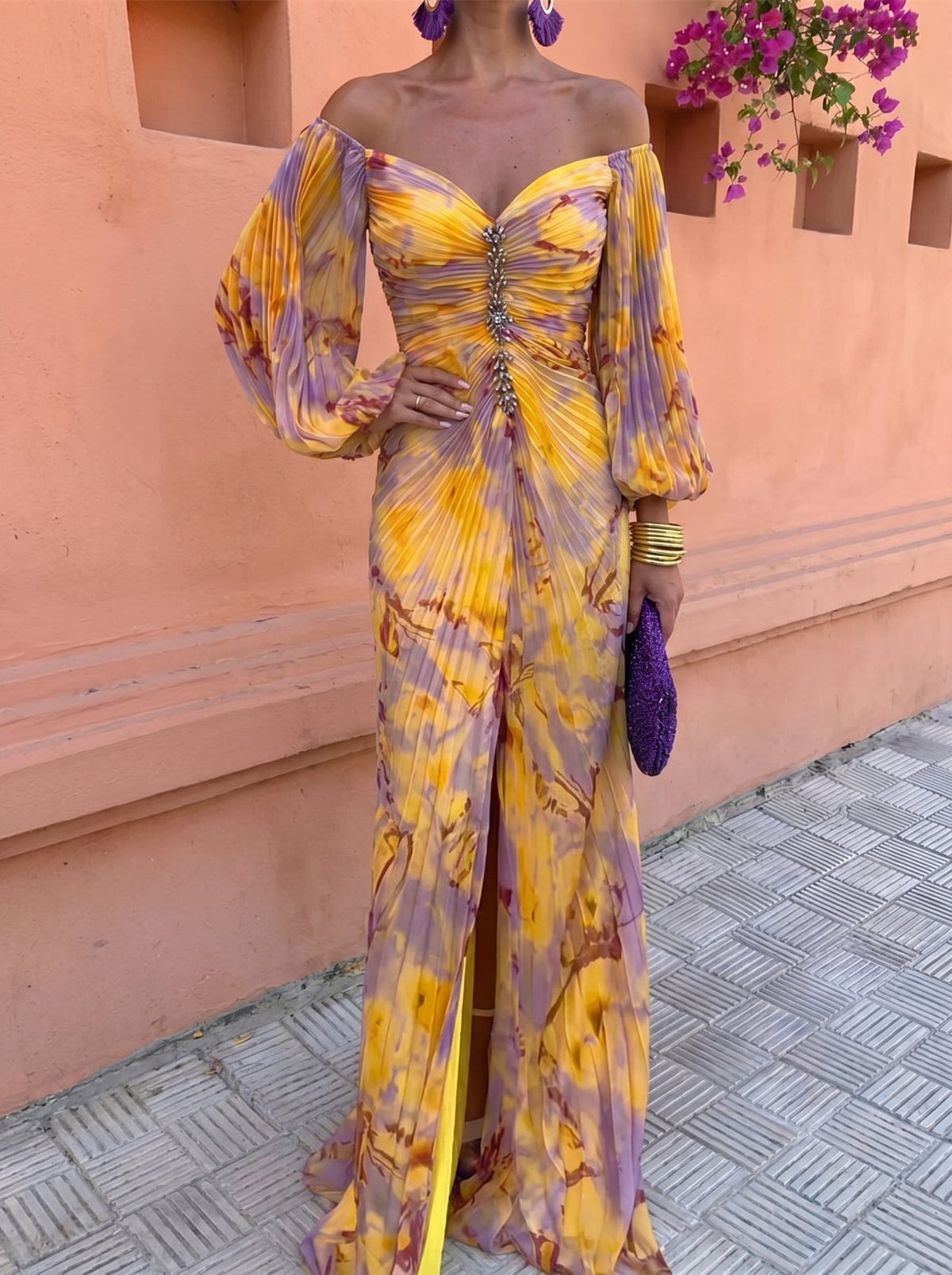 Close-up detail of the vibrant floral print on the light and airy fabric of the elegant maxi dress.