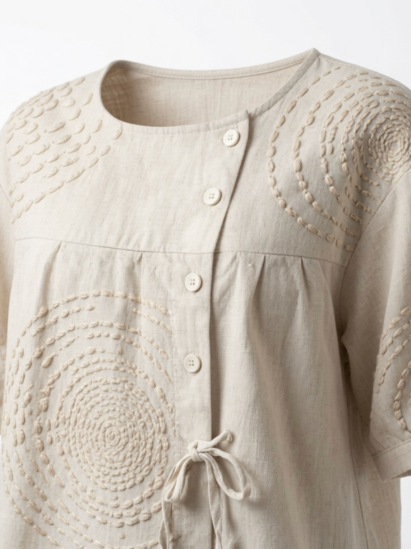 Side profile of the Seraphina casual top, illustrating the relaxed fit and the asymmetric button placket.