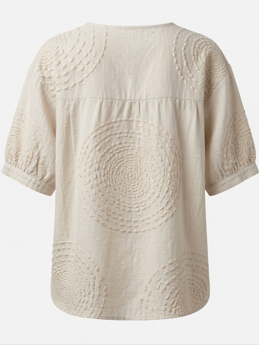 Back view of the Seraphina top, emphasizing the flowing silhouette and the quality of the fabric.
