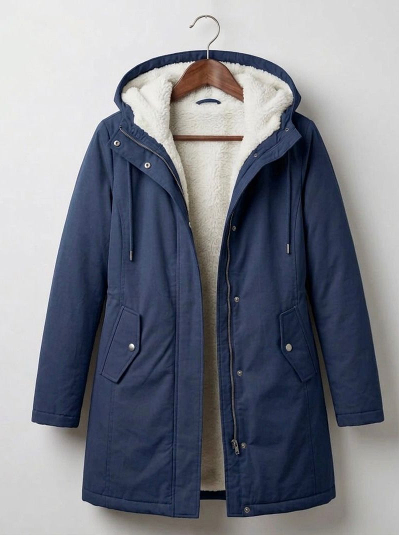 Front view of the Elara waterproof parka in classic black, showcasing its tailored silhouette and functional design.