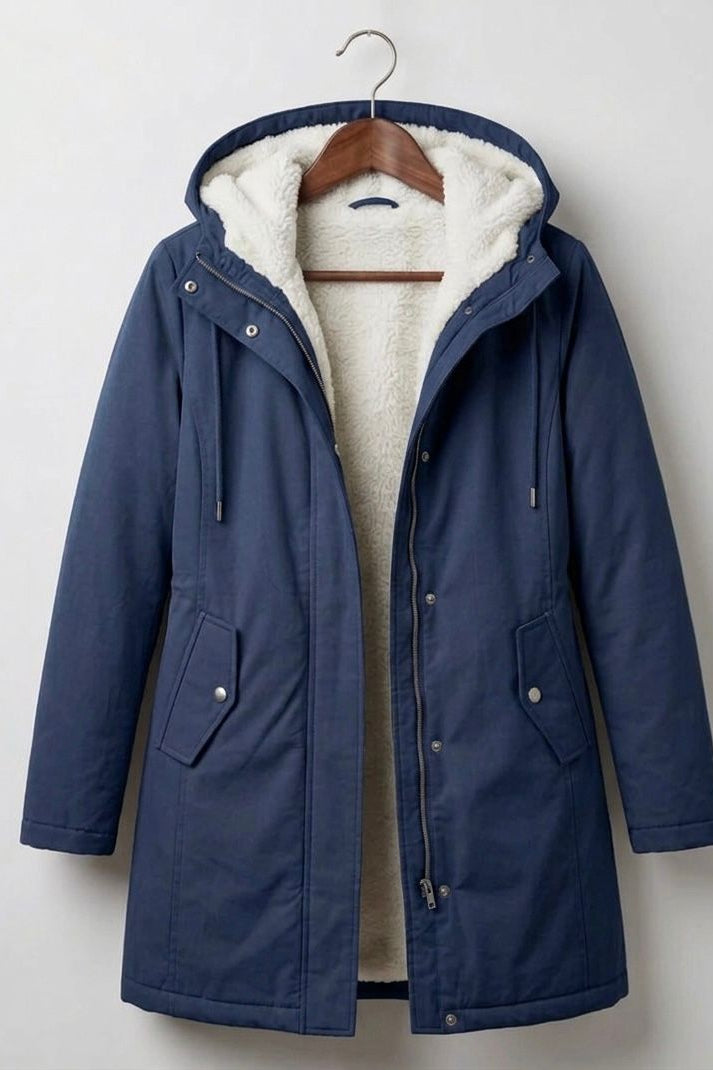 Front view of the Elara waterproof parka in classic black, showcasing its tailored silhouette and functional design.