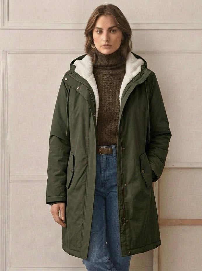 The interior of the Elara waterproof parka, showcasing the full coverage of the high-loft fleece lining.
