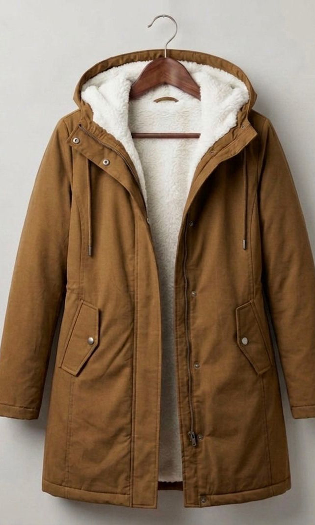 Three-quarter view of the Elara parka in a rich forest green, styled for a casual yet elegant look.