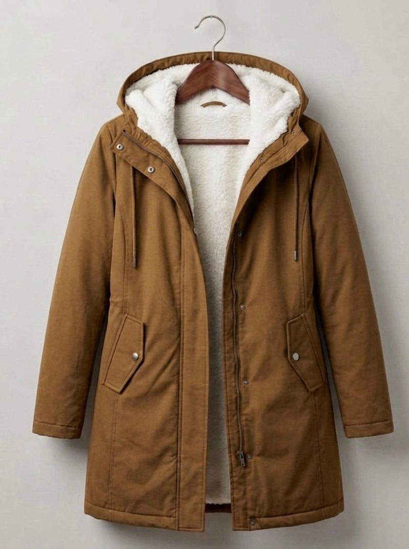 Three-quarter view of the Elara parka in a rich forest green, styled for a casual yet elegant look.