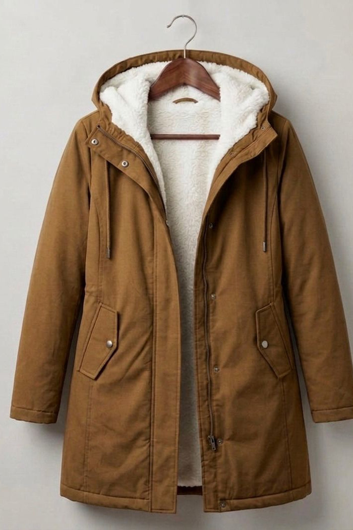 Three-quarter view of the Elara parka in a rich forest green, styled for a casual yet elegant look.