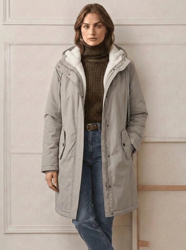 A close-up of the Elara parka's waterproof zipper and storm flap, ensuring maximum moisture resistance.