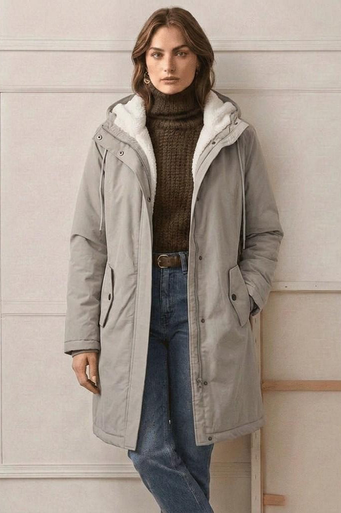 A close-up of the Elara parka's waterproof zipper and storm flap, ensuring maximum moisture resistance.