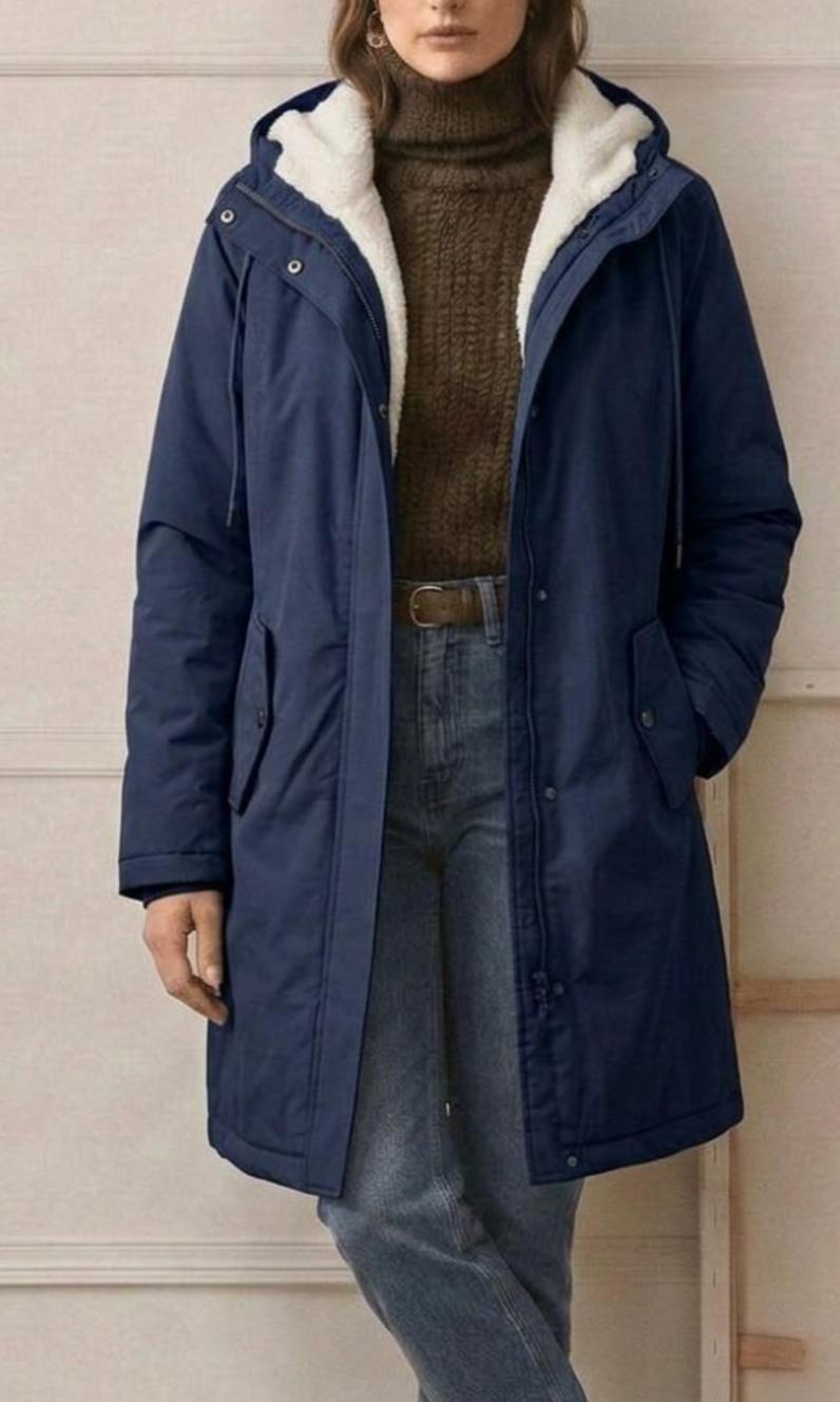 Side profile of the Elara fleece-lined parka, highlighting the length and subtle waist taper for a flattering fit.