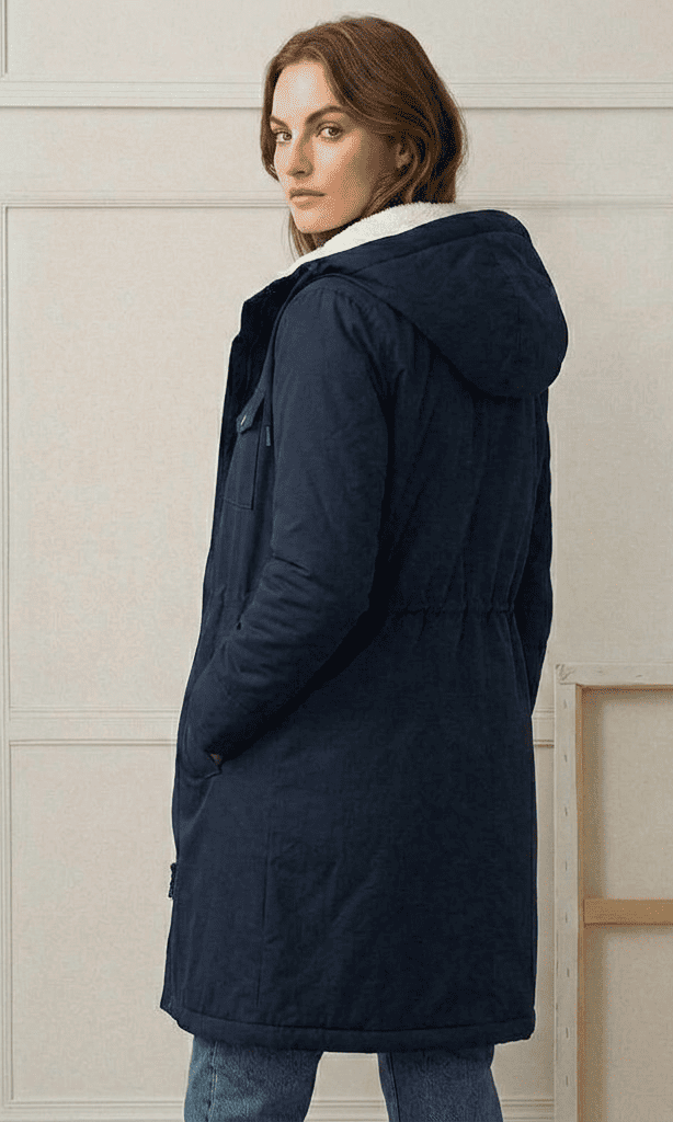 Close-up of the Elara parka's waterproof outer fabric texture, demonstrating its robust rain protection.