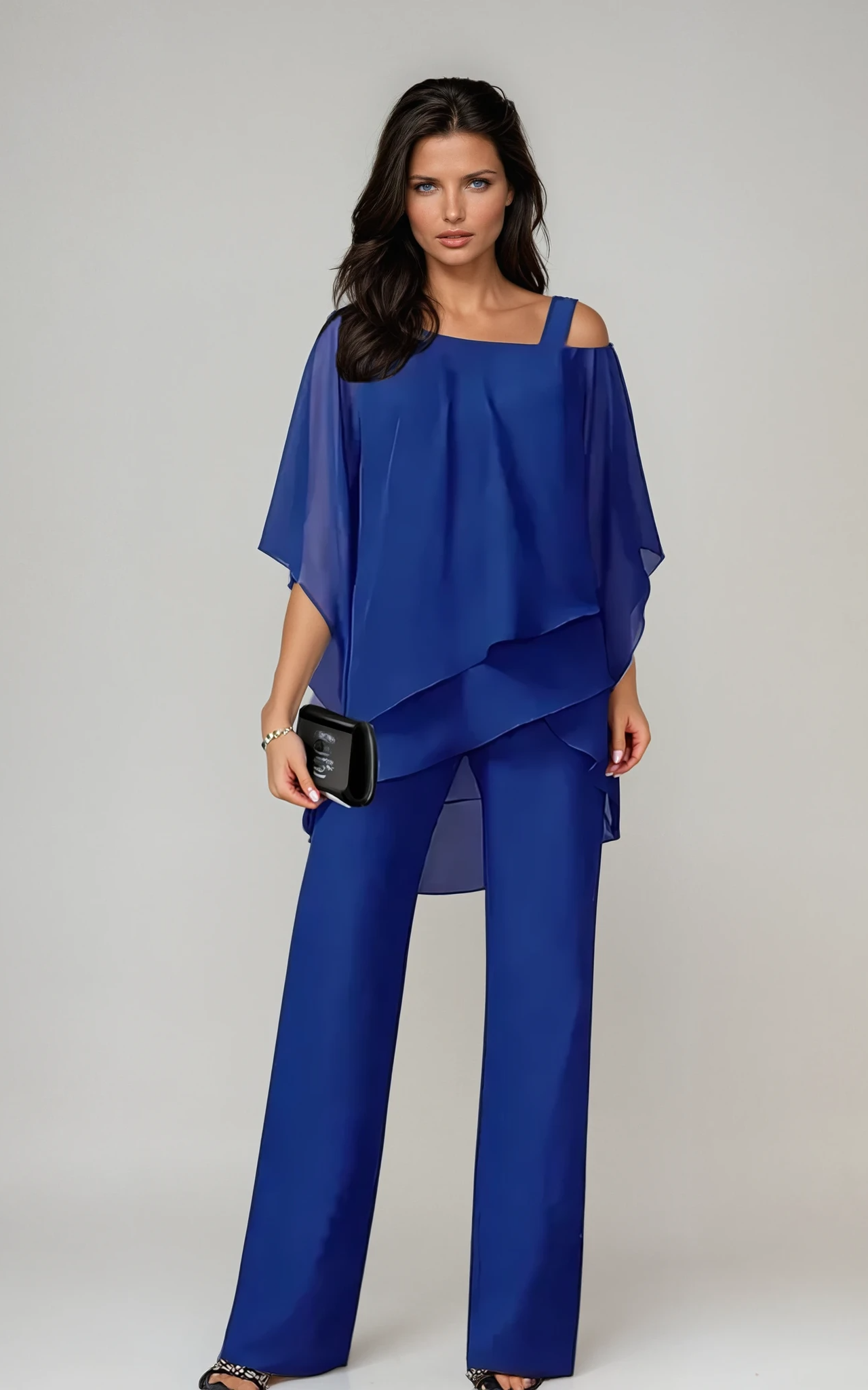 Side profile of a woman wearing the Elara two-piece layered set, highlighting the graceful silhouette and movement.