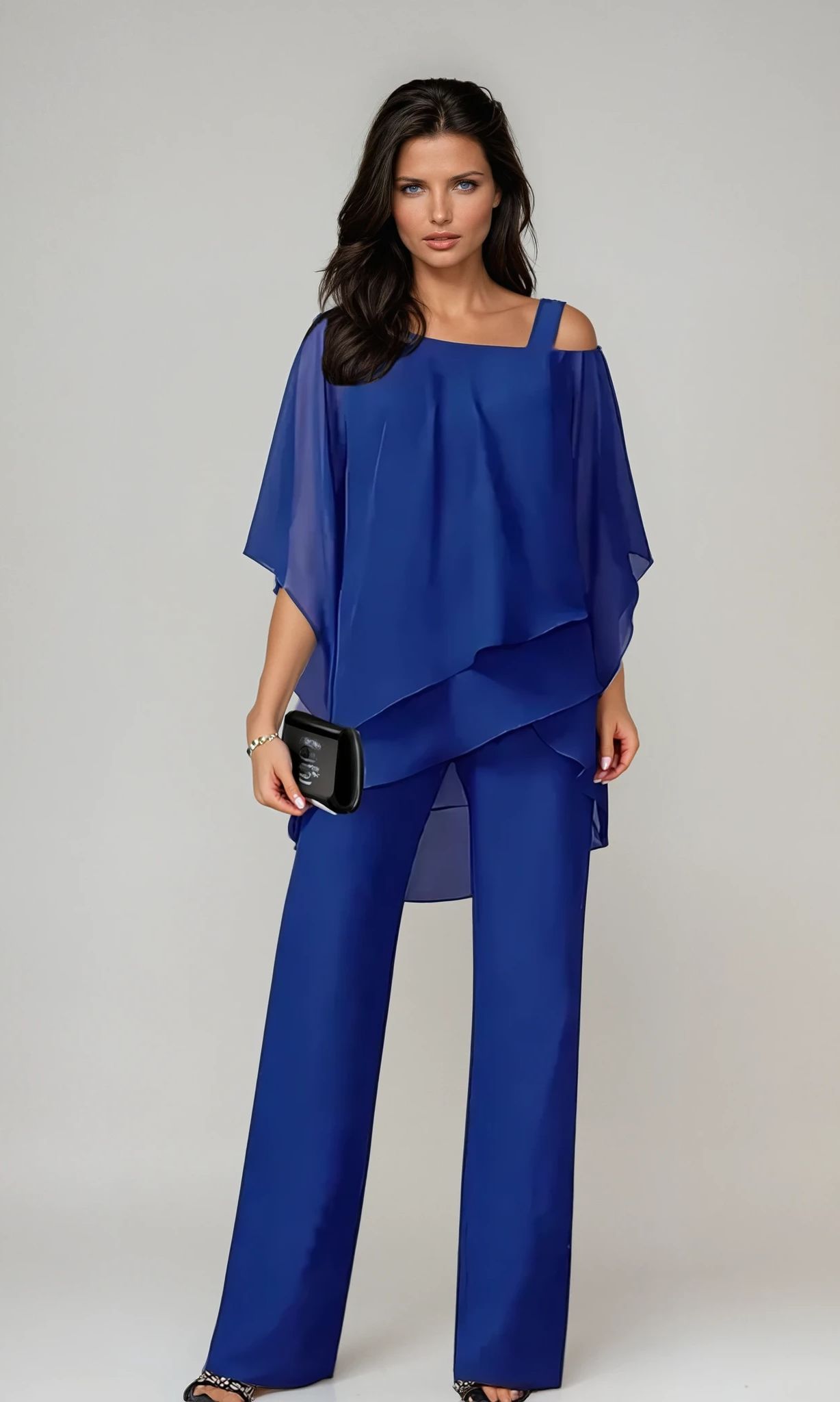 Side profile of a woman wearing the Elara two-piece layered set, highlighting the graceful silhouette and movement.