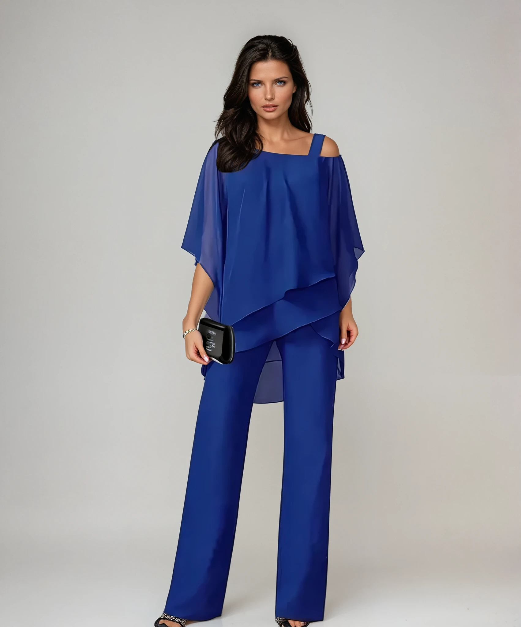 Side profile of a woman wearing the Elara two-piece layered set, highlighting the graceful silhouette and movement.