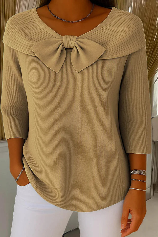 Side profile of a model wearing the pink elegant knitted top, demonstrating the comfortable and stylish fit.