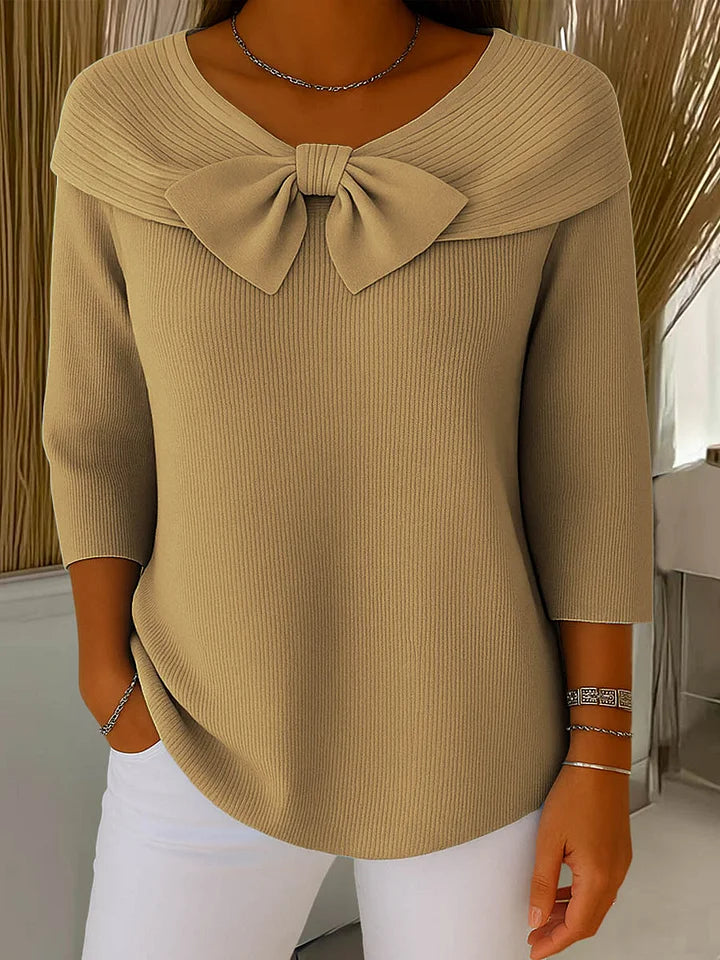 Side profile of a model wearing the pink elegant knitted top, demonstrating the comfortable and stylish fit.