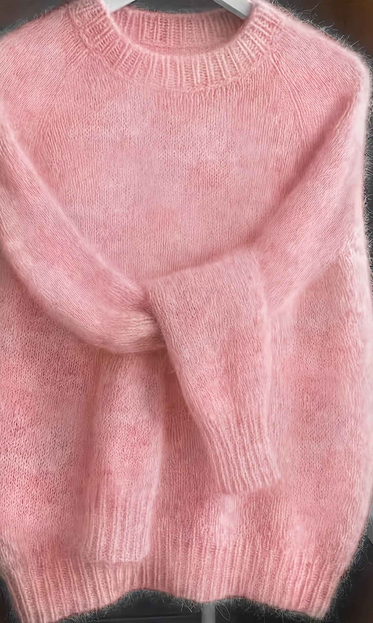 Back view of the soft pink Elara cashmere-blend sweater, showing the smooth fabric and flattering cut.