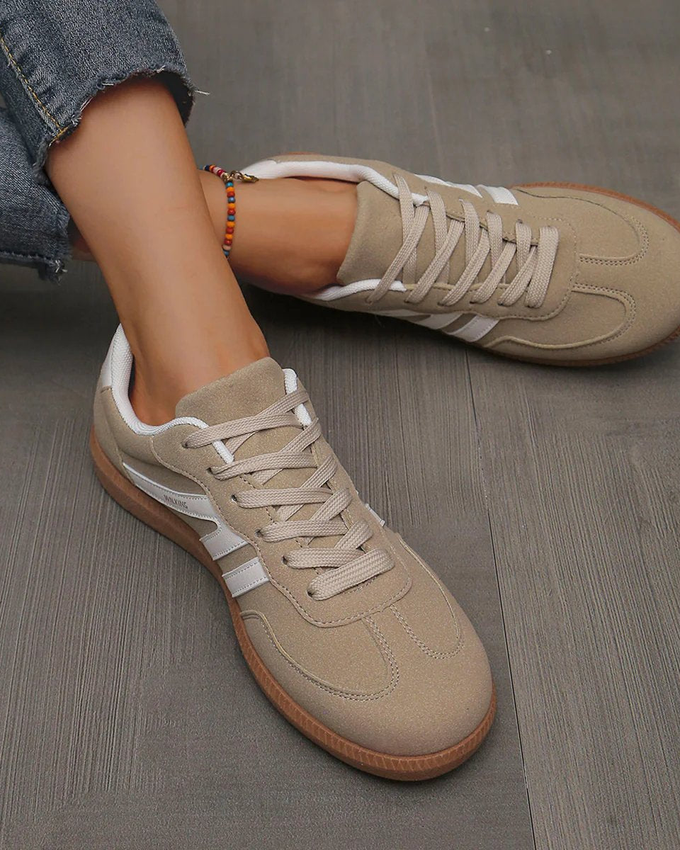 Top-down perspective of the off-white Elara orthopaedic cushioned trainer, showing the foot opening and interior cushioning.