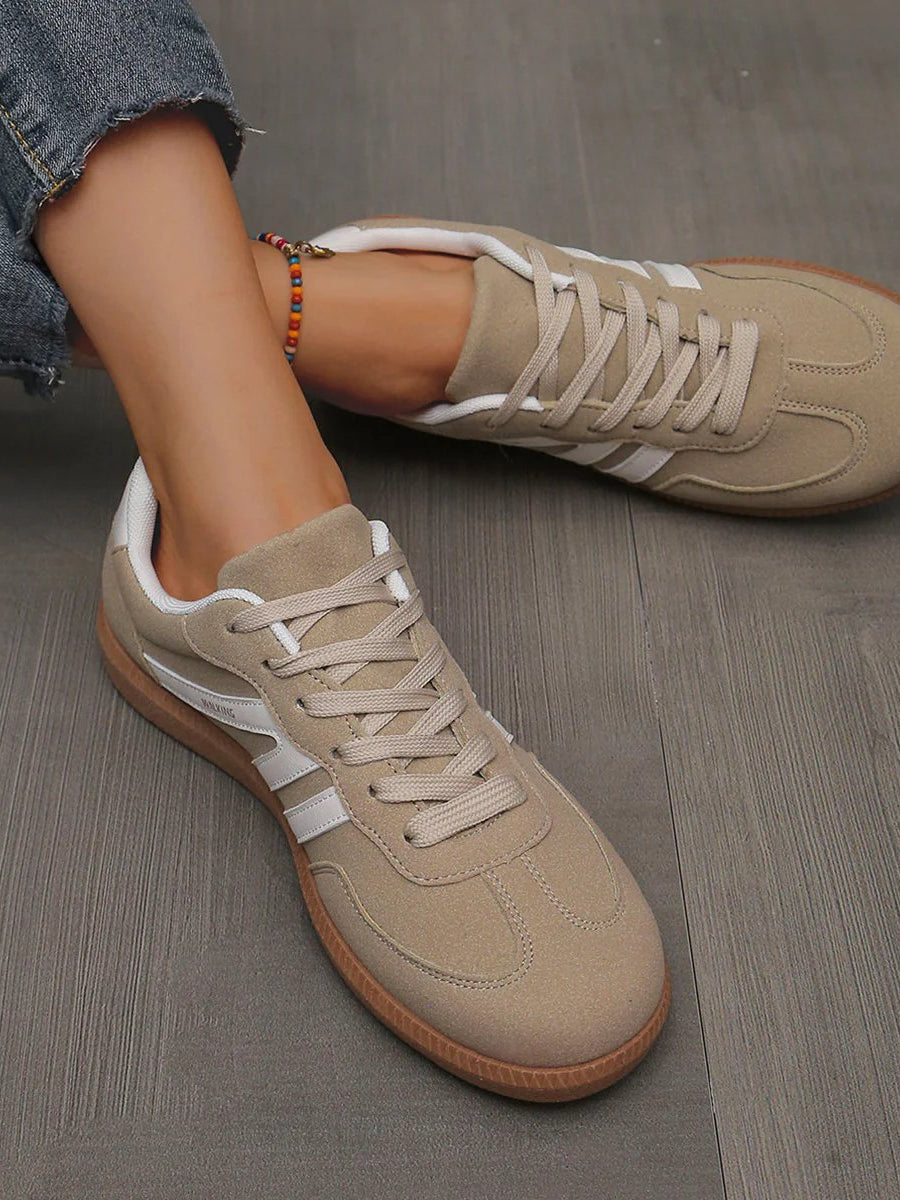 Top-down perspective of the off-white Elara orthopaedic cushioned trainer, showing the foot opening and interior cushioning.