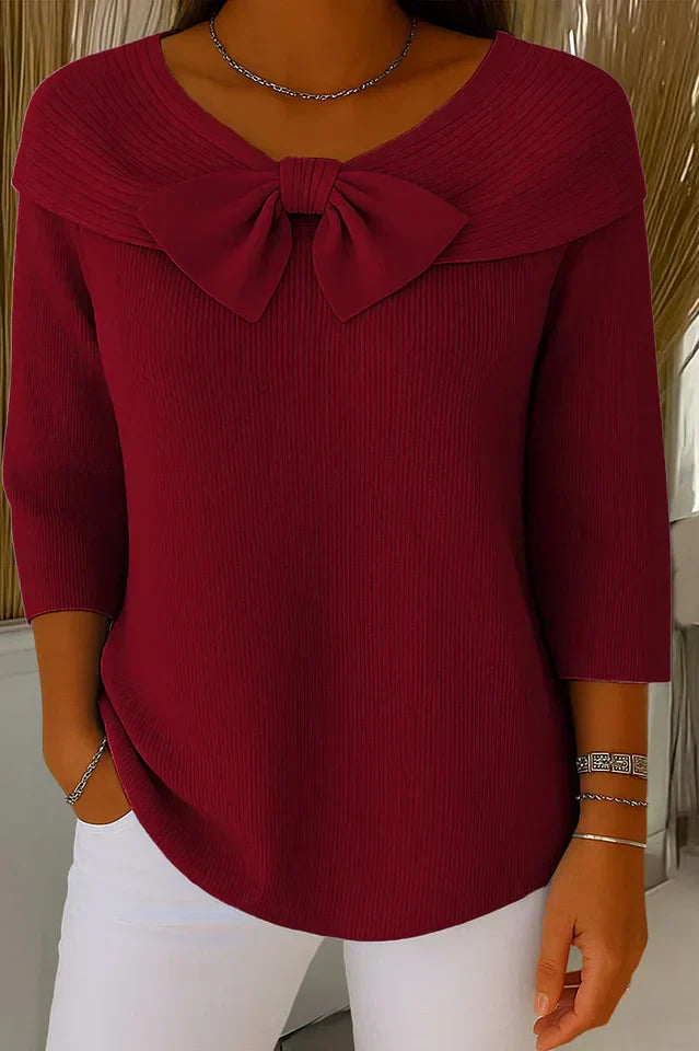 Back view of the khaki elegant knitted top, emphasizing the garment's overall drape and seamless design.