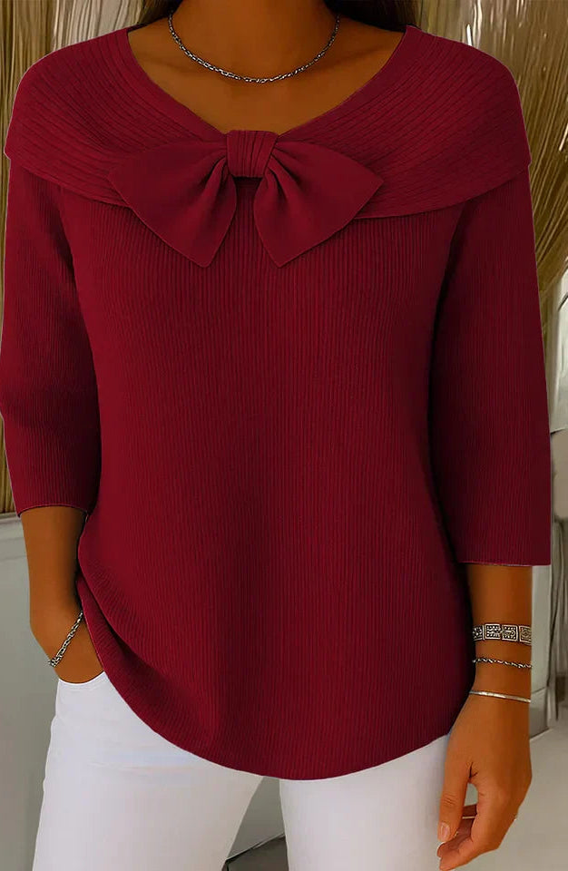 Back view of the khaki elegant knitted top, emphasizing the garment's overall drape and seamless design.