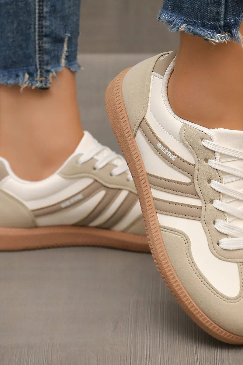 Detail of the breathable mesh upper on an off-white Elara orthopaedic cushioned trainer, indicating ventilation features.